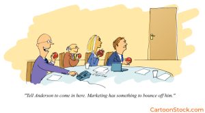 Cartoon showing employees waiting to throw food at a marketing employee entering the room. This caption suggests they have something to bounce off him.